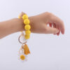 Wholesale New Cartoon sunflower love keychain pendant handmade beaded tassel silicone bracelet wrist keychain