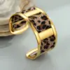 Wholesale Wide Open Stainless Steel Bracelet Plated In 18K Gold With Stylish Leopard Print Ribbon Fashionable Jewelry Accessory For Women