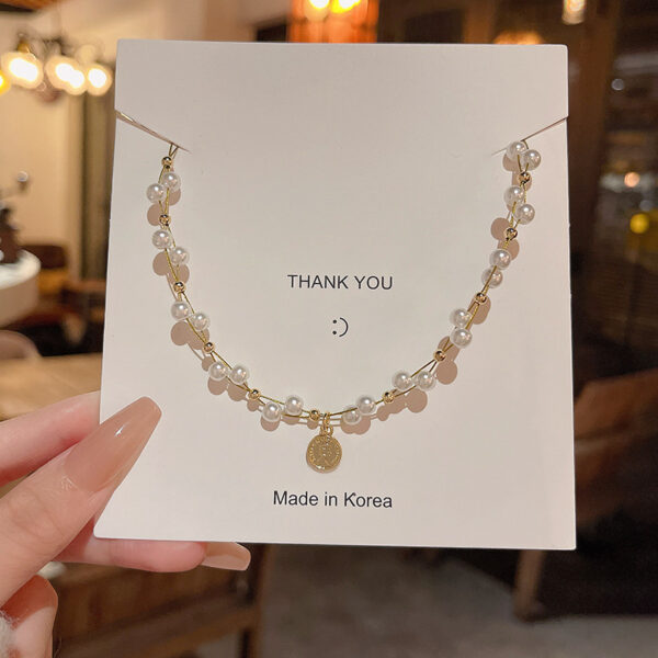 Wholesale European and American retro portrait pendant necklace women's ins tide light luxury niche high-end twisted pearl clavicle chain