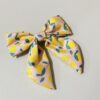 oly-1736f93c47a75f3e948678f1f24f13d9 Wholesale Fabric lemon knotted bow hair clip