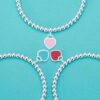 Wholesale brass-plated sier heart bracelet with enamel blue, red, and pink hearts. High-value women's bracelet, opshipping available.