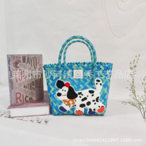 Green colorful hand basket with apple dachshund