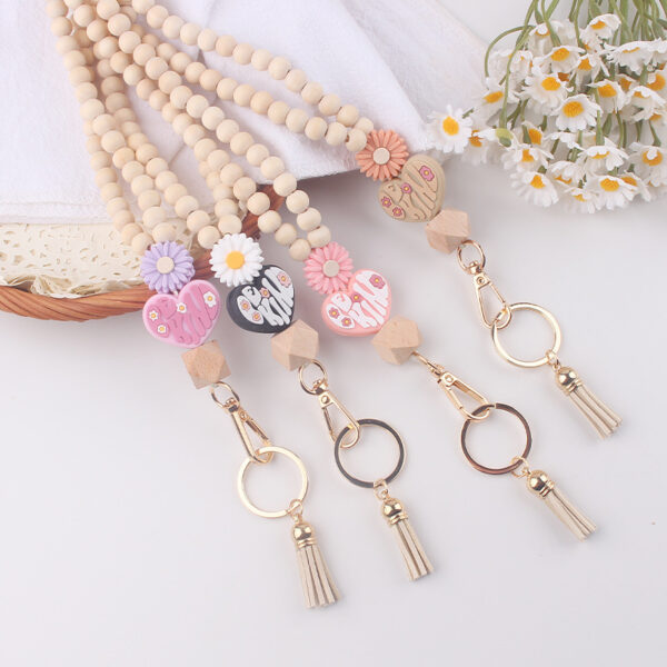 oly-1900a060d76a62bfbd172d1b63e2d897 Wholesale New Wooden Bead Necklace Keychain Cartoon Silicone Daisy Beaded Pendant Bracelet Keychain Accessories