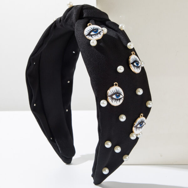 Wholesale Korean style elegant fabric headband studded with pearls, round evil eye design, fashionable wide-brimmed knotted hair accessory for women.