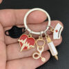 Wholesale Nurse Doctor Mask Keychain Medical and Ambulance Personnel Key Ring Syringe Syringe Syringe Stethoscope Keychain