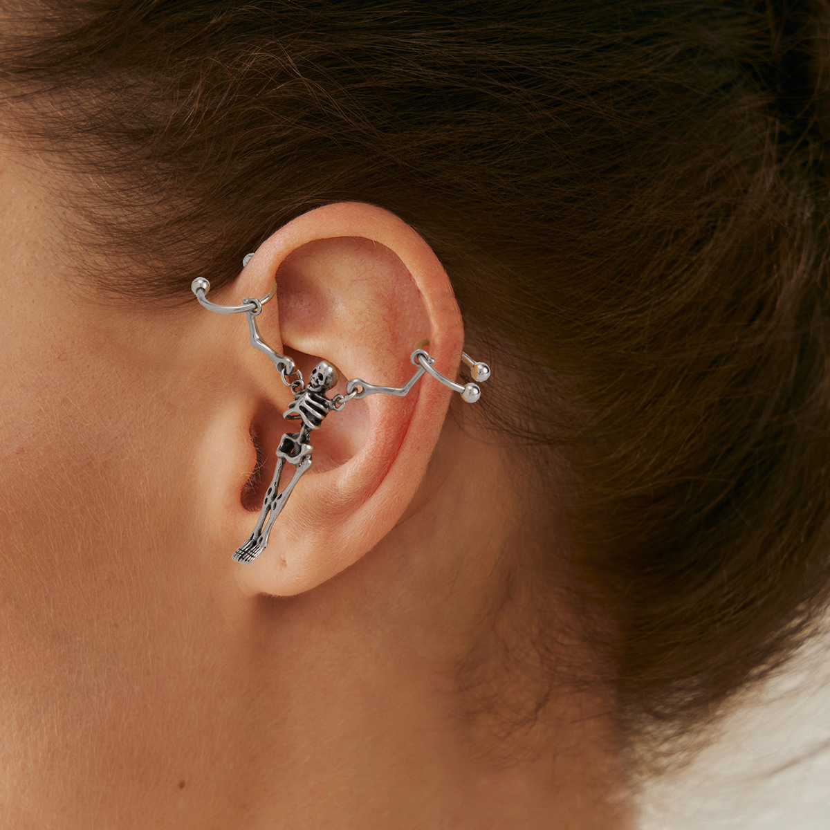 Wholesale Sweet and cool titanium steel skull ear stud earrings