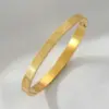Wholesale Retro Symbol Titanium Steel Bangle In Bulk