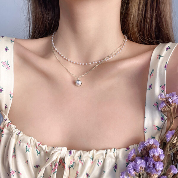 Wholesale European and American fashion double-layer Pearl clavicle chain temperament retro cold wind pendant design personality versatile necklace women