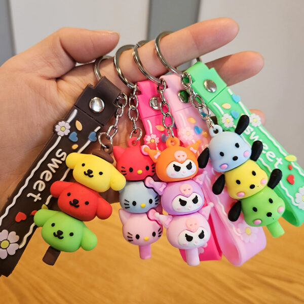 oly-1e40483487649b23d1934d2a865ca094 Wholesale Sanrio Yugui dog jengle keychain cute cartoon melody pudding dog PVC doll bag pendant