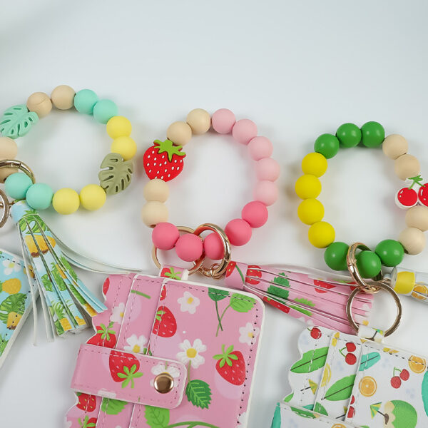 oly-1f53eb34f1dda02e12de5ca4ee3e6c52 Wholesale Fruit Print Pu Card Holder Silicone Beaded Keychain Silicone Bead Bracelet