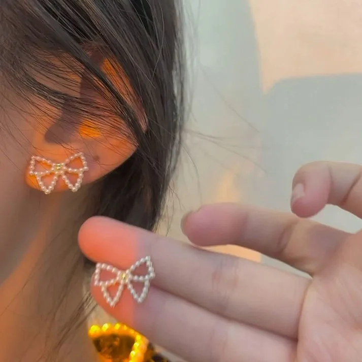 Wholesale Simple Style Bow Knot Inlaid Pearls Alloy No Inlaid Earrings Ear Studs