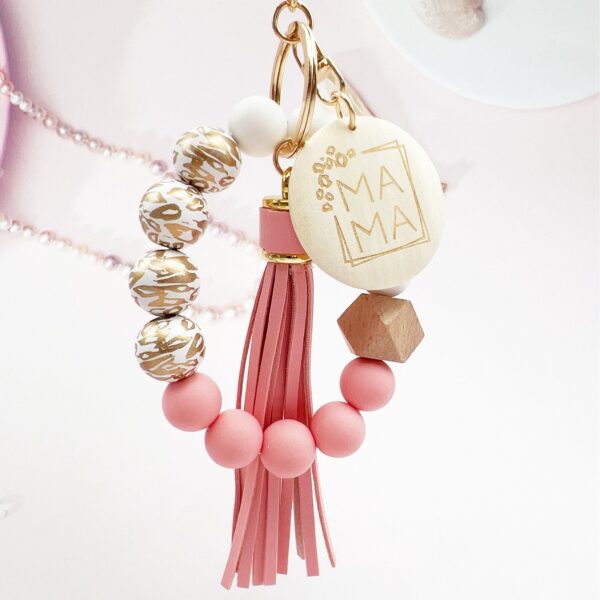 oly-21e191d38b1cf66f2db454a81c8d623a Wholesale Silicone Beads Tassel Wood Beads Wrist Keychain