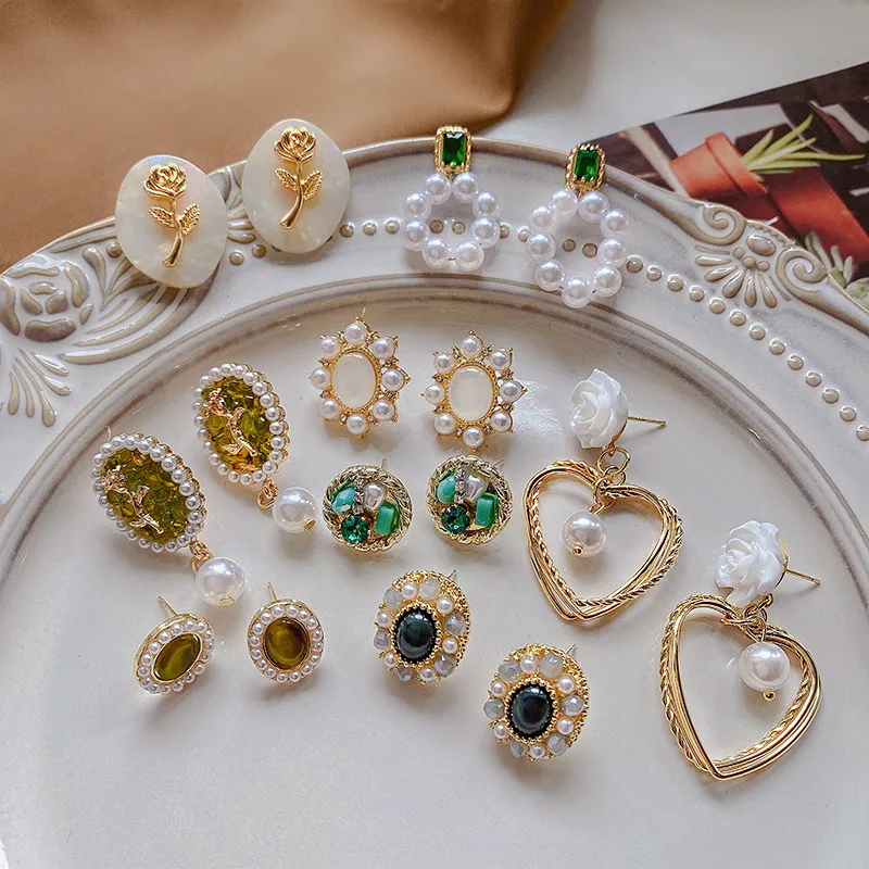 Wholesale 1 Pair Fashion Heart Shape Flower Alloy Inlay Artificial Pearls Zircon Women's Ear Studs