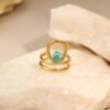 Wholesale Openwork irregular blue zircon stainless steel ring with gold plating