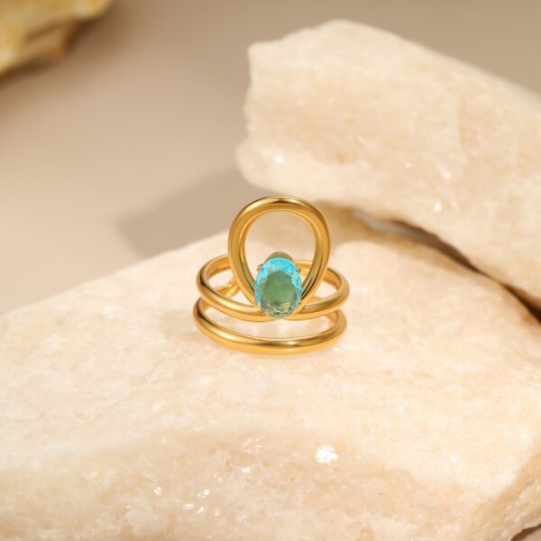 Wholesale Openwork irregular blue zircon stainless steel ring with gold plating