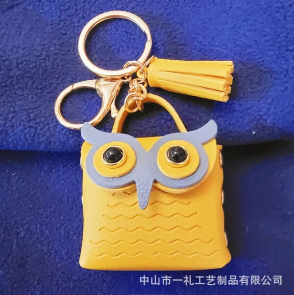 oly-2a92cf0d16a25cf9cae779e7be3f9236 Wholesale New Pu Leather Owl Coin Purse Cute Cartoon Bluetooth Headset Bag Fashion Tassel Car Key Pendant