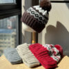 Wholesale Christmas wool hat for women, warm and cute winter pom-pom ear flap hat