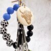 oly-2e32fdd973235ea3a977a6210f0261fd Wholesale Western Style Dairy Wood Beads Silicone Beaded Round Wood Pieces Yak Keychain