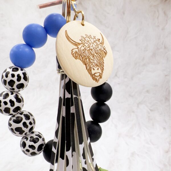 oly-2e32fdd973235ea3a977a6210f0261fd Wholesale Western Style Dairy Wood Beads Silicone Beaded Round Wood Pieces Yak Keychain
