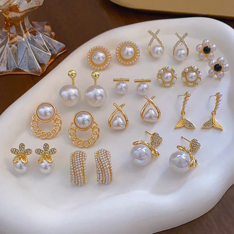 Wholesale 1 Pair Elegant Simple Style Streetwear Flower Bow Knot Plating Inlay Alloy Artificial Pearls Zircon Ear Studs