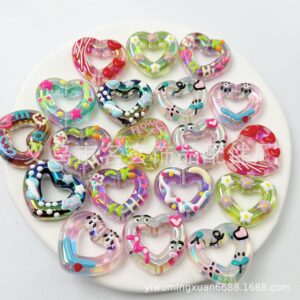 oly-30ce4f08ad21e25463bc48183663771f Wholesale Acrylic Hand-painted Candy Heart Color Hollow Love Beads