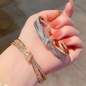 Wholesale High-end copper diamond-encrusted cross-shaped ribbon bracelet, a versatile and luxurious diamond-encrusted bracelet for best friends.