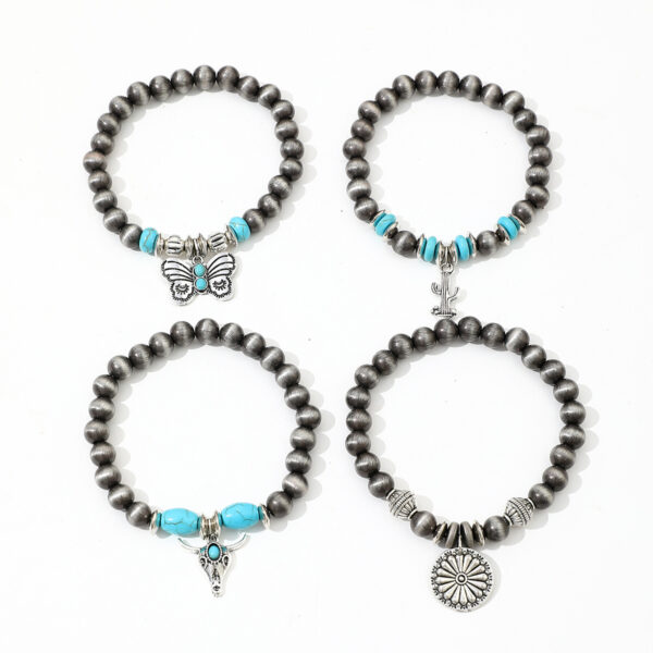 Wholesale Imitation pearl cactus butterfly bull's head flower elastic bracelet, vintage turquoise patchwork CCB bracelet set for women.