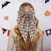 Wholesale New Halloween hair accessories featuring pumpkin skulls, ghost hands, and bows; spring clips for party decorations.