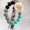 oly-32cfbab1fdfc723667daeebef005b555 Wholesale Western Style Dairy Wood Beads Silicone Beaded Round Wood Pieces Yak Keychain