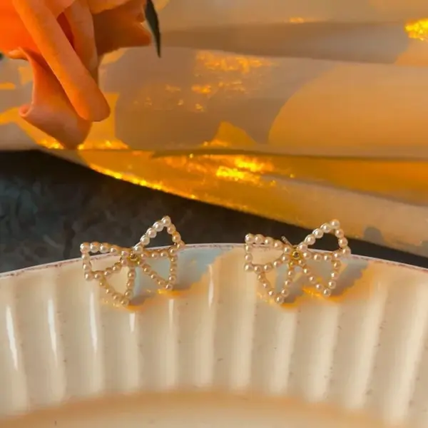 Simple Style Bow Knot Inlaid Pearls Alloy No Inlaid Earrings Ear Studs