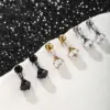 Wholesale 1 Pair Hip-Hop XUPING Punk Solid Color Plating Inlay 304 Stainless Steel Artificial Gemstones 18K Gold Plated Raw Steel Ear Studs