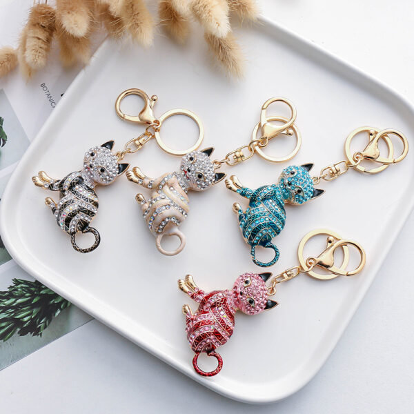 oly-37a6bd1a55f2e06f4425df688136f6cc Wholesale New Color Diamond-Encrusted Cartoon Cat Creative Metal Keychain Pendant Car Pendant Factory Direct Supply Small Gifts