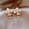 Wholesale French-style luxury earrings with diamond and pearl embellishments, featuring a unique and sophisticated aesthetic.