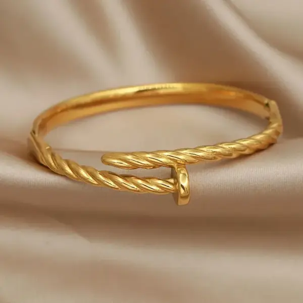 Wholesale 304 Stainless Steel Twist Ion Plating (IP) Real Gold Plated Simple Style Classic Style Waterproof Non Tarnish Asymmetrical Buckle Gold Bangle