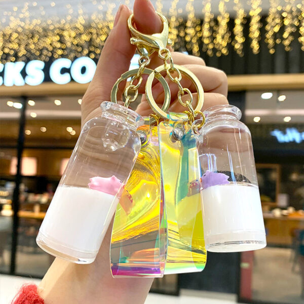 Wholesale Creative Internet red floating pig milk pig keychain cartoon quicksand oil drift bottle car bag pendant