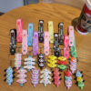 oly-3b8c5272a8236d55aa1b30cf2661110d Wholesale Sanrio Yugui dog jengle keychain cute cartoon melody pudding dog PVC doll bag pendant
