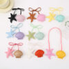oly-40d1bae79ed7a1a3784fe14a95c3b45a Wholesale New cartoon starfish shell bag pendant accessories