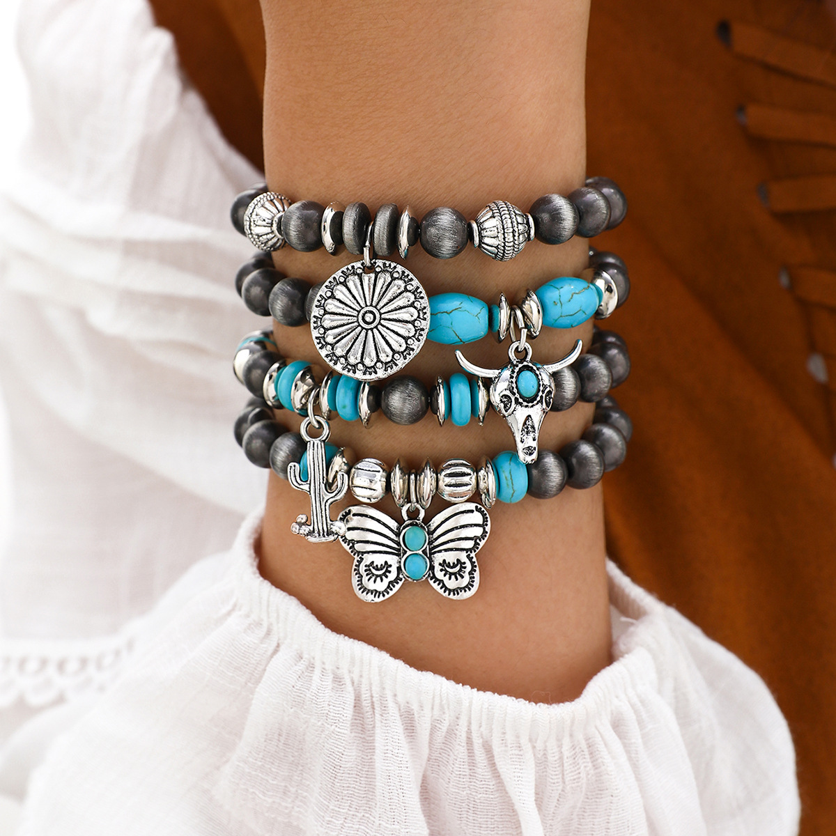 Wholesale Imitation pearl cactus butterfly bull's head flower elastic bracelet, vintage turquoise patchwork B bracelet set for women.