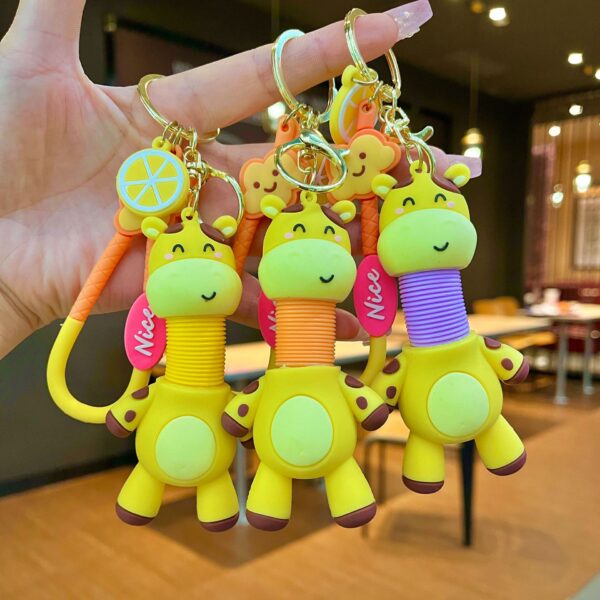 Wholesale Cartoon retractable giraffe doll children's toy creative car keychain couple schoolbag pendant gift