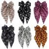 Wholesale New Halloween hair accessories featuring pumpkin skulls, ghost hands, and bows; spring clips for party decorations.