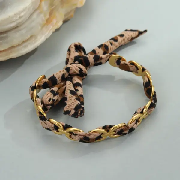Wholesale Wide Open Stainless Steel Bracelet Plated In 18K Gold With Stylish Leopard Print Ribbon Fashionable Jewelry Accessory For Women
