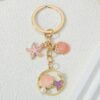 Wholesale Cross-border starfish shell keychain creative oil pearl keychain bag pendant girls pvc key chain