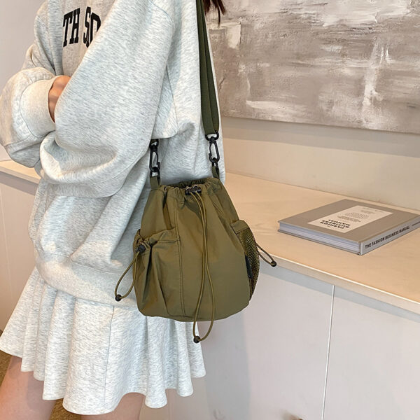 oly-474262d3b068fcc03ca427143dc31a26 Wholesale Japanese Style Ins Niche Design awstring Bucket Outdoor Srts Casual Fashion All-match Nylon Crossbody Bag