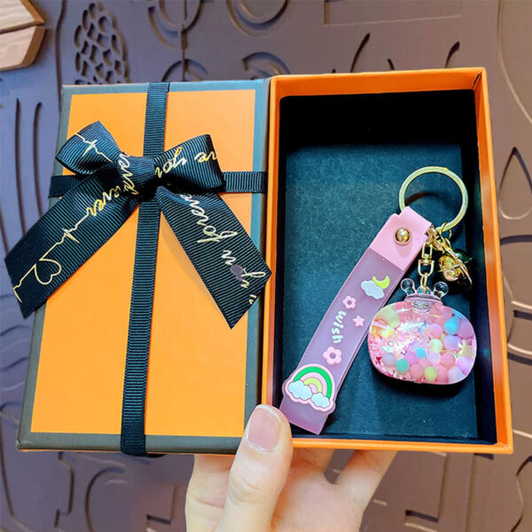 oly-4775f1526c5f0679a9b25b7a470bf4e2 Wholesale Acrylic Crown snowflake quicksand oil keychain female book bag pendant car key chain creative gift