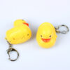 Wholesale In stock cute cartoon duck car keychain LED luminous sound creative electronic toy small gift bag ornaments