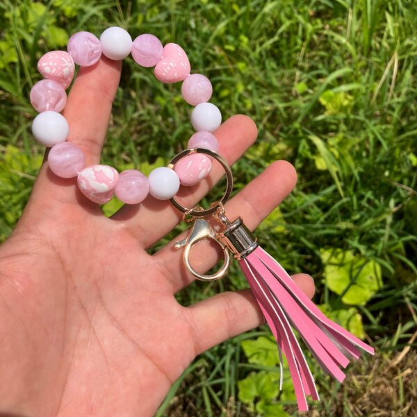 oly-4a3b3ce9f19419573cc36f0d31e32e6e Wholesale Colorful beaded heart-shaped printed tassel bracelet/keychain