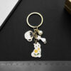 Wholesale Cross-border Hot Cartoon Oil Dropping Pearl Tea Cup White Cat Keychain Metal Alloy Bag Jewelry Pendant