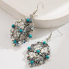 Wholesale Retro-style turquoise inlaid geometric cross earrings for women