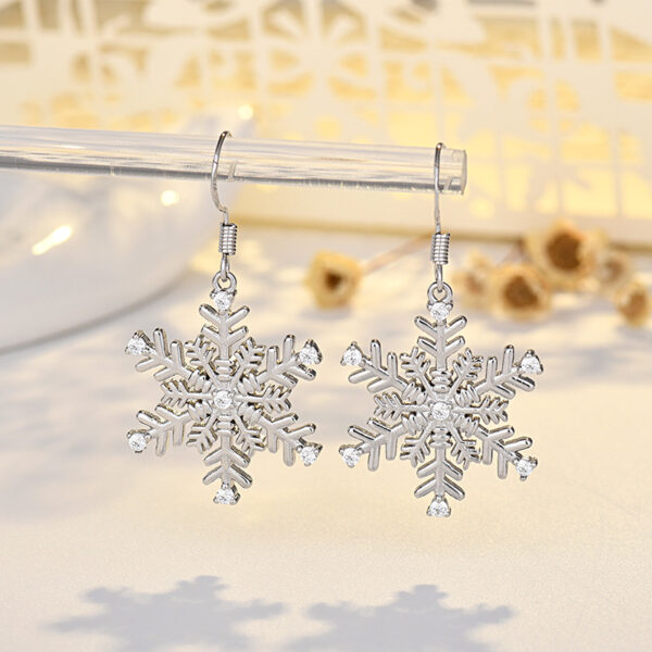 Wholesale Large gold-tone earrings with micro-embellished snowflakes