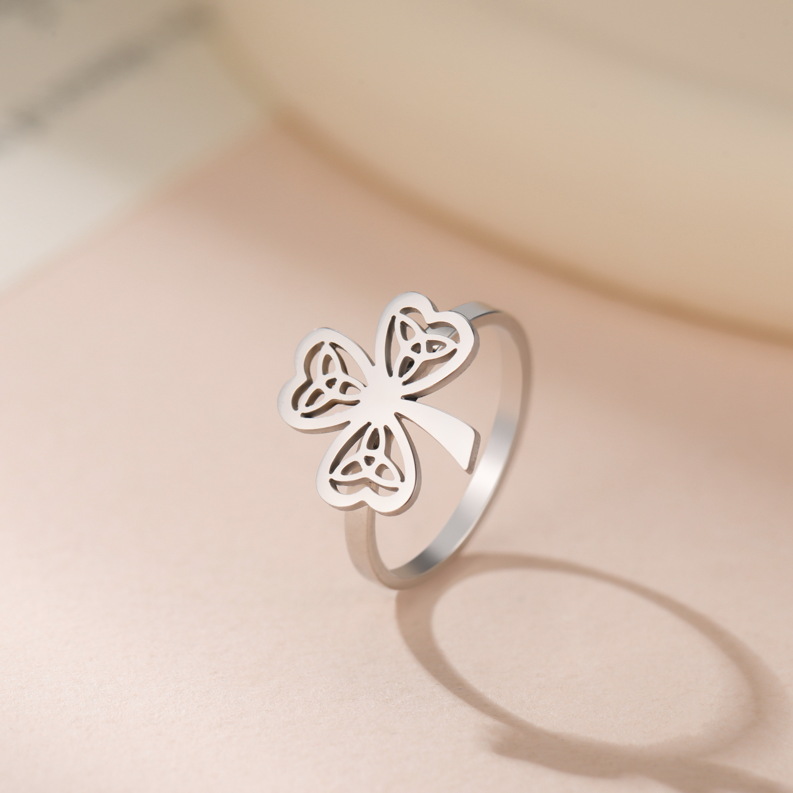 Wholesale Cross-border jewelry wholesale fashion high-end stainless steel hollow Celtic knot three-petal grass plug-in welding ring women